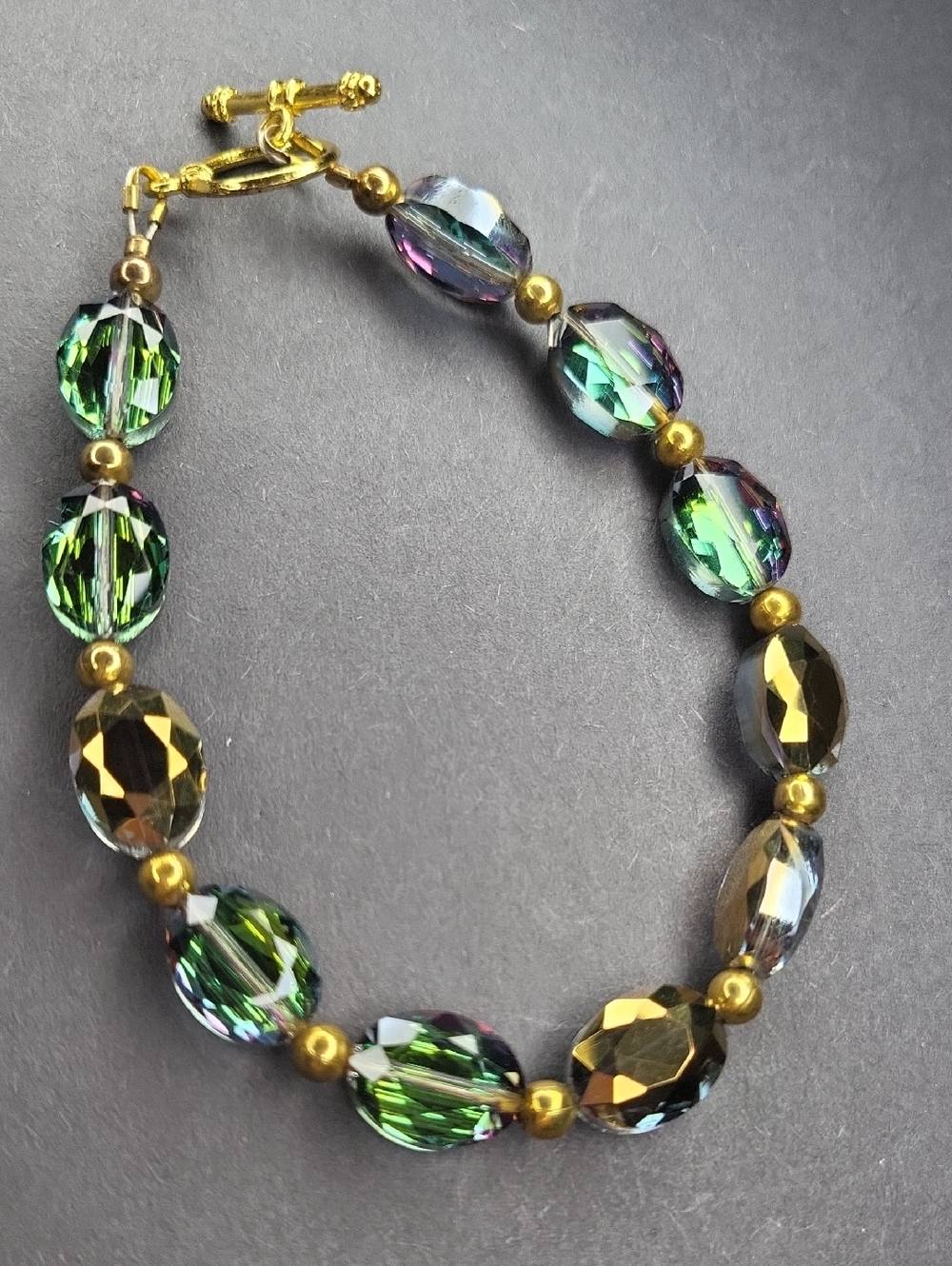 Green and Iridescent Beaded Bracelet with Gold Accents